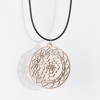 Sri Yantra necklace birch wood hanging isolated